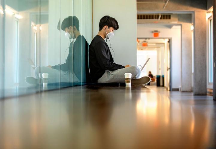 A student working in a hallway